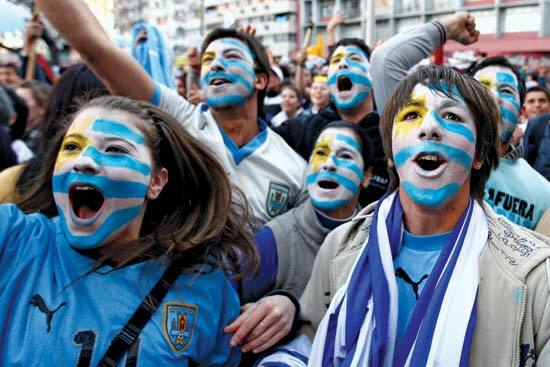 uruguay flag faces of fans