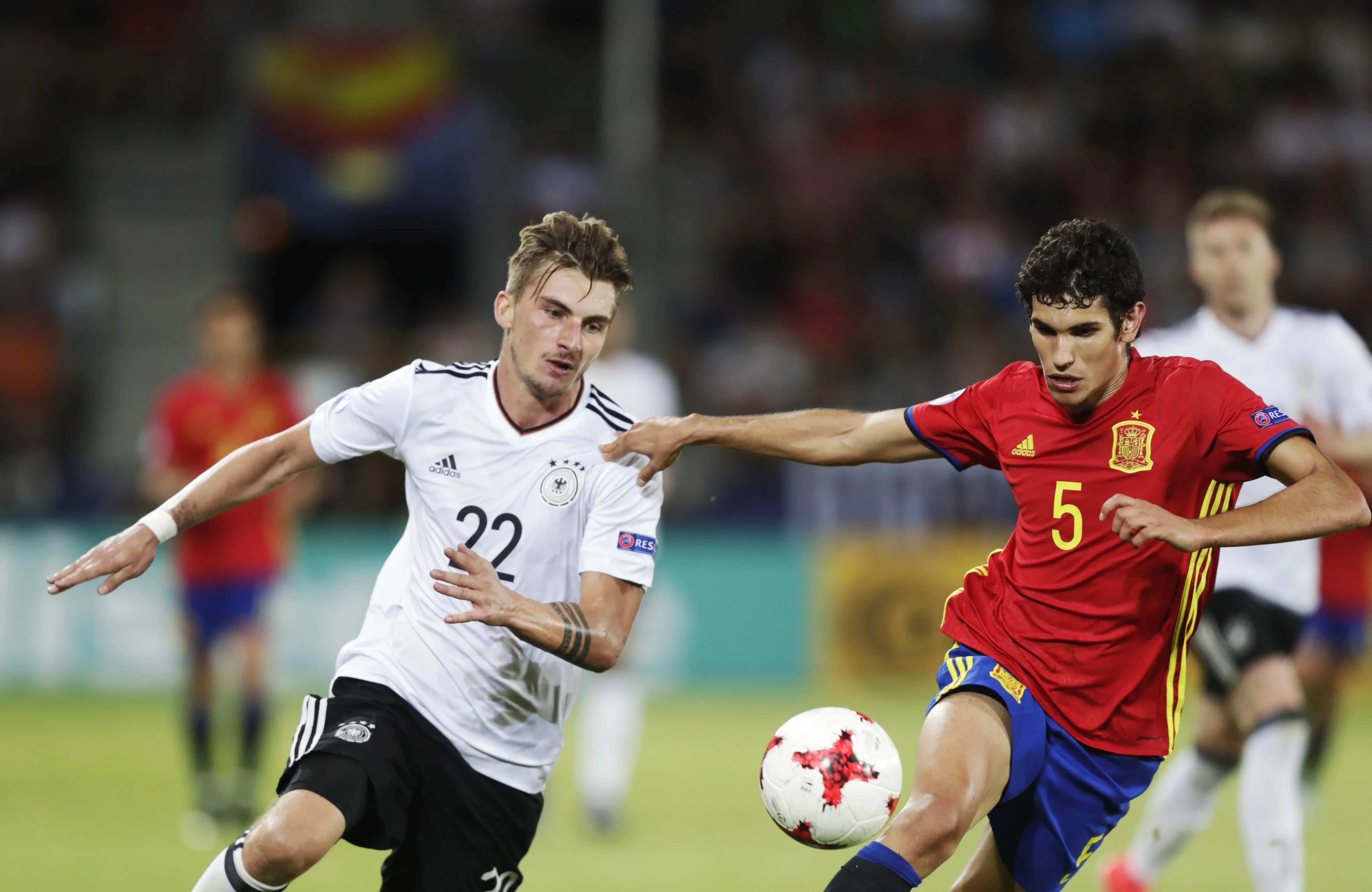 Germany vs spain players in the football ground playing soccer game Germany vs spain players in the football ground playing soccer game