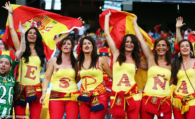 Girls cheer spain with country flag