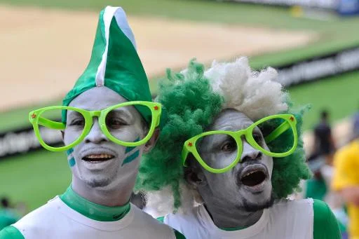 great looking Nigeria soccer fans with country color dress